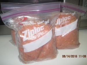 Place the sandwich bags into quart or gallon freezer bags, depending on the space in your freezer. Now you can pull a day's worth of food out at a time. You could even make each bag hold a single meal for one or more cats and place the sandwich bag into a shallow bowl of warm water to warm it up at mealtime.